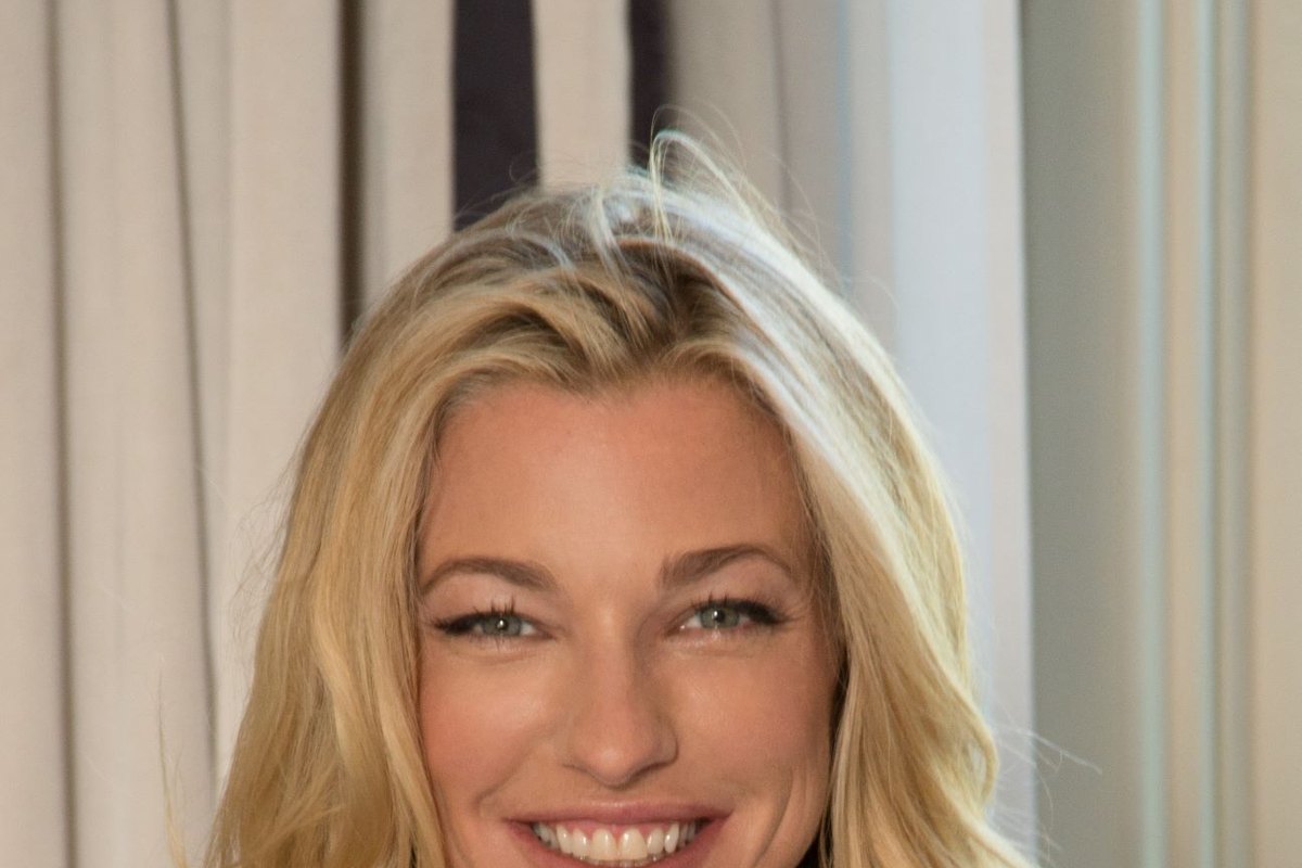 Nicole Junkermann smiling in a bright interior, a close portrait